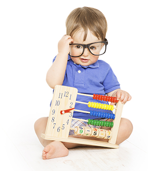toddler with abacus